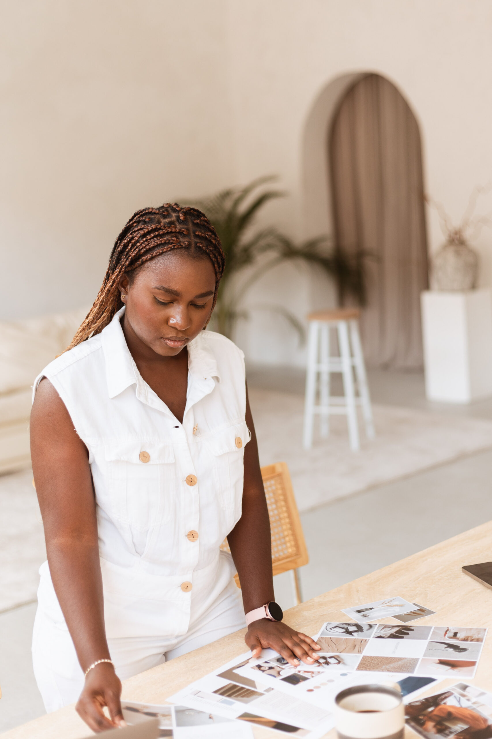 personal brand photography of woman entrepreneur looking at mockups